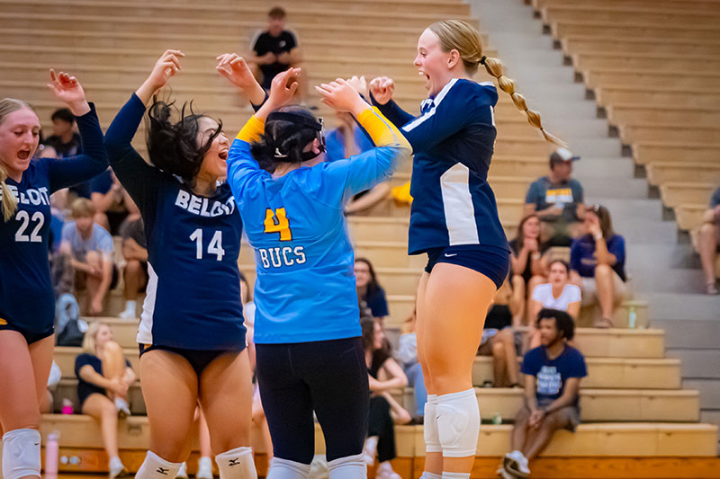 Student athletes cheering in a vollyball game. Links to Tangible Personal Property Student athletes cheering in a vollyball game. Links to Tangible Personal Property