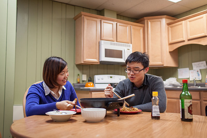 A couple eating dinner. 