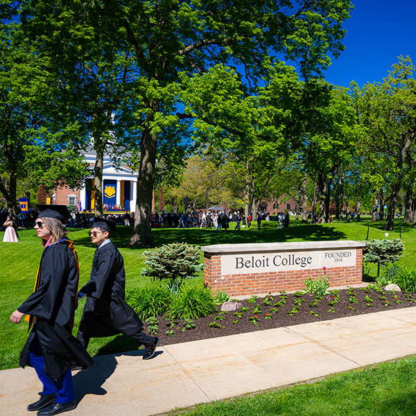 Graduates walking through campus